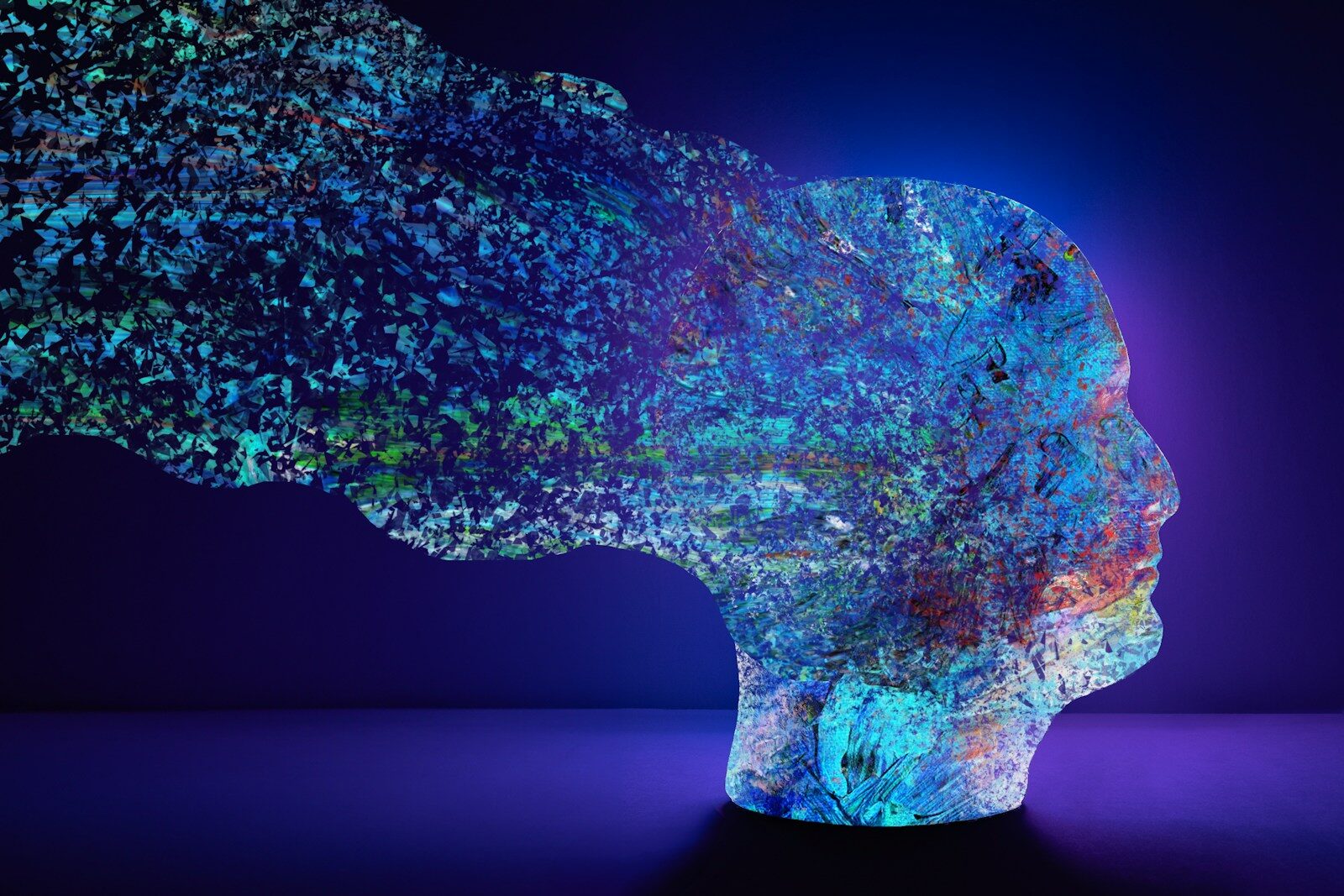 Abstract head with colorful nature elements dissolving